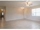 Spacious living room with tile floors and neutral wall colors at 1839 Overcup Ave, Saint Cloud, FL 34771