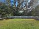 Private backyard with grassy area and fence at 1884 Hickory Bluff Rd, Kissimmee, FL 34744