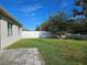 Backyard with patio and view of house exterior at 1884 Hickory Bluff Rd, Kissimmee, FL 34744