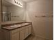 Double sink bathroom with granite countertop and shower at 1884 Hickory Bluff Rd, Kissimmee, FL 34744