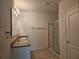 Double vanity bathroom with granite countertops and shower at 1884 Hickory Bluff Rd, Kissimmee, FL 34744