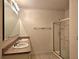 Double vanity bathroom with granite countertops and shower at 1884 Hickory Bluff Rd, Kissimmee, FL 34744