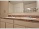 Double vanity bathroom with granite countertops at 1884 Hickory Bluff Rd, Kissimmee, FL 34744