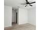 Spacious bedroom with ceiling fan and neutral carpeting at 1884 Hickory Bluff Rd, Kissimmee, FL 34744