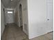 Clean hallway with tiled floors and access to other rooms at 1884 Hickory Bluff Rd, Kissimmee, FL 34744