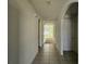 Interior hallway with tiled floor and archways at 1884 Hickory Bluff Rd, Kissimmee, FL 34744