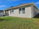 Rear view of house, showing windows and patio at 1884 Hickory Bluff Rd, Kissimmee, FL 34744