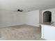 Spacious living room with ceiling fan and neutral carpeting at 1884 Hickory Bluff Rd, Kissimmee, FL 34744