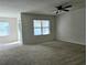 Bright living room with sliding glass doors and window at 1884 Hickory Bluff Rd, Kissimmee, FL 34744