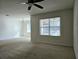 Spacious living room featuring a ceiling fan and neutral decor at 1884 Hickory Bluff Rd, Kissimmee, FL 34744