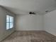 Large living room with neutral walls and carpet at 1884 Hickory Bluff Rd, Kissimmee, FL 34744