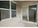 Private patio with sliding glass doors and view at 1884 Hickory Bluff Rd, Kissimmee, FL 34744