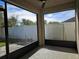 Screened patio with view of fenced backyard at 1884 Hickory Bluff Rd, Kissimmee, FL 34744