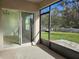Bright screened patio with access to backyard at 1884 Hickory Bluff Rd, Kissimmee, FL 34744