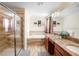 Primary bathroom with double vanity and walk-in shower at 4738 Sleepy Hollow Dr, Kissimmee, FL 34746