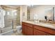 Elegant bathroom with double vanity and a shower at 4738 Sleepy Hollow Dr, Kissimmee, FL 34746