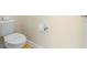 Simple, clean bathroom with toilet and hardwood floors at 4738 Sleepy Hollow Dr, Kissimmee, FL 34746