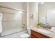 Bathroom with granite countertop, bathtub and shower at 4738 Sleepy Hollow Dr, Kissimmee, FL 34746