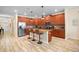 Modern kitchen with wood cabinets, granite countertops, and island at 4738 Sleepy Hollow Dr, Kissimmee, FL 34746