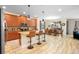 Modern kitchen with wood cabinets, granite countertops, and island at 4738 Sleepy Hollow Dr, Kissimmee, FL 34746
