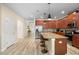 Modern kitchen with wood cabinets, granite countertops, and island at 4738 Sleepy Hollow Dr, Kissimmee, FL 34746
