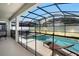 Screened-in pool and spa with patio furniture at 4738 Sleepy Hollow Dr, Kissimmee, FL 34746