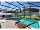 Relaxing screened-in pool and spa with lounge chairs at 4738 Sleepy Hollow Dr, Kissimmee, FL 34746