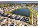 Aerial view of lakefront homes and neighborhood at 5170 Buttonsage Dr, Saint Cloud, FL 34772