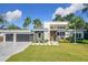 Modern two-story home with a two car garage and beautifully landscaped lawn at 1123 Webster Ave, Orlando, FL 32804