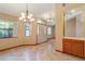 Dining room with tile floors and a view to the entryway at 12504 Blue Heron Way, Leesburg, FL 34788