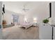 Main bedroom with carpeted floor, large window, and ample closet space at 1398 Zest Ave, The Villages, FL 32163