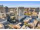 Aerial perspective of a modern high-rise building amongst other structures in a city at 155 S Court Ave # 1316, Orlando, FL 32801