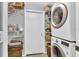 Convenient laundry room with washer, dryer, and storage shelving at 2111 Staunton Ave, Winter Park, FL 32789