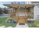 Inviting front porch with wooden railings and steps at 3260 Se 32Nd Ct, Ocala, FL 34471