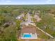 Aerial view of a house with a pool, showcasing the property and surrounding neighborhood at 3553 Greenfield Ave, Orlando, FL 32808