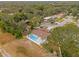 Aerial view showing a single-Gathering home with a pool in a residential neighborhood at 3553 Greenfield Ave, Orlando, FL 32808