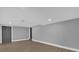 Unfinished basement area with gray block walls and wood-look floors at 3553 Greenfield Ave, Orlando, FL 32808