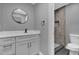 Modern bathroom with white vanity, quartz countertop, and grey tile shower at 3553 Greenfield Ave, Orlando, FL 32808