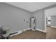 Unfinished laundry room with water heater and wood-look floors at 3553 Greenfield Ave, Orlando, FL 32808