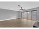 Spacious living room with sliding glass doors and ceiling fan at 3553 Greenfield Ave, Orlando, FL 32808
