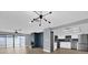 Open living space with fireplace, kitchen access, and sliding doors to patio at 3553 Greenfield Ave, Orlando, FL 32808