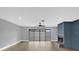 Living area with sliding glass doors to backyard and a fireplace at 3553 Greenfield Ave, Orlando, FL 32808