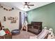 Bedroom with crib, teepee, and play area at 3617 Epperstone Ct, Apopka, FL 32712