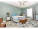 Bright and airy bedroom with ceiling fan and ample closet space at 3814 Manor Oaks Ct, Leesburg, FL 34748