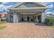 Exterior view of the garage with brick driveway at 3899 Nw 46Th Ter, Ocala, FL 34482