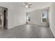 Spacious bedroom with hardwood floors and ceiling fan at 5493 Orange Orchard Dr, Winter Garden, FL 34787