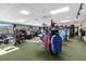 Well-lit pro shop with various apparel and equipment on display at 6121 Sunnyvale Dr # Ge, Orlando, FL 32822