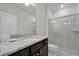 Bathroom with granite countertop and a walk-in shower at 866 Paradise Dr, Davenport, FL 33897