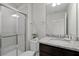 Clean bathroom with granite vanity and a walk-in shower at 866 Paradise Dr, Davenport, FL 33897
