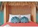 Tropical themed bedroom with coral bedding and shell pillows at 866 Paradise Dr, Davenport, FL 33897